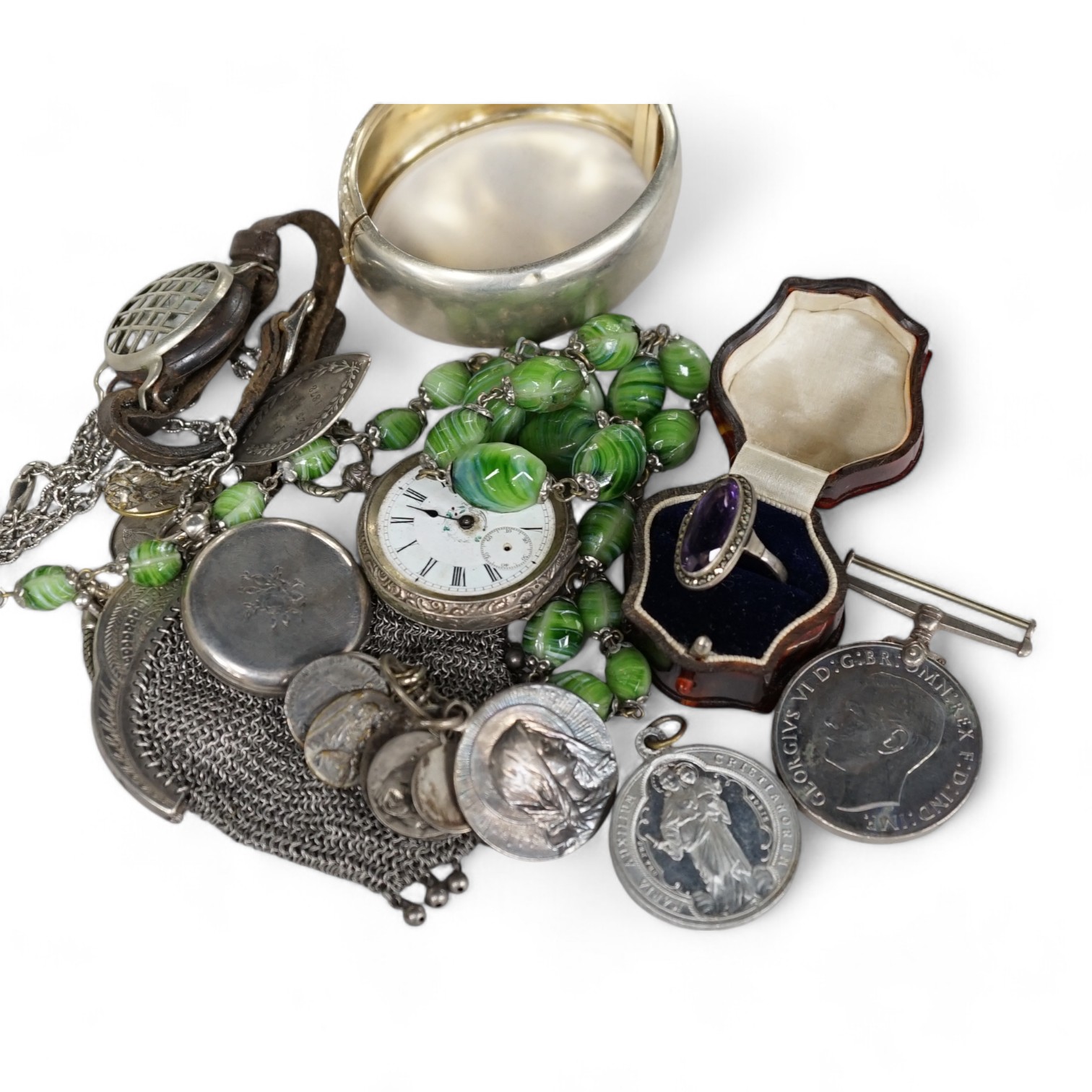 A collection of assorted mainly Victorian and later jewellery, including a yellow metal overlaid locket, a white metal, gem and Scottish hardstone set brooch, an Arts & Crafts gilt white metal garnet and emerald? set cir